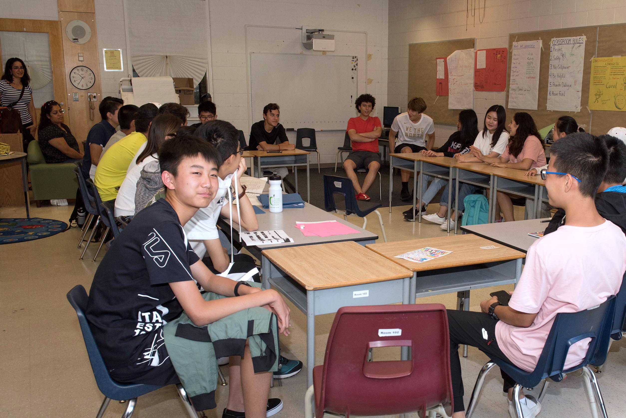 Students sitting at desks in a classroom Open Gallery